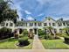 Charming townhouse showcasing a beautifully landscaped front yard and inviting walkway at 5620 Whitehead St, Bradenton, FL 34203