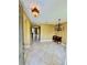 Inviting foyer with tile flooring, decorative lighting, and archway leading to other rooms at 5620 Whitehead St, Bradenton, FL 34203