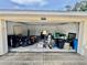 Unfinished garage with door open to reveal abundant storage space for organizing tools, toys, and other household belongings at 5620 Whitehead St, Bradenton, FL 34203