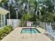 Cozy community hot tub provides a relaxing atmosphere surrounded by lush landscaping and tropical plants at 5620 Whitehead St, Bradenton, FL 34203