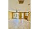 Living room offering tile floors, ceiling fan, and access to the backyard through sliding glass doors at 5620 Whitehead St, Bradenton, FL 34203