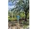 Community sign post with directional markers for John's Island, Canoe Launch and Observation Deck at 5620 Whitehead St, Bradenton, FL 34203