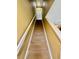 Carpeted staircase with white railings, leading to the upper level of the home at 5620 Whitehead St, Bradenton, FL 34203