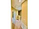 Upstairs hallway with carpeted floor, neutral paint, and views into another room at 5620 Whitehead St, Bradenton, FL 34203