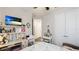 Bright bedroom with a vanity area, built-in desk, and ample closet space creating an organized and stylish retreat at 5927 Maidenstone Way, Palmetto, FL 34221