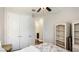 Inviting bedroom with ensuite bathroom access and white shelving offers convenience and stylish storage at 5927 Maidenstone Way, Palmetto, FL 34221