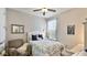 Cozy bedroom with neutral walls, carpet, and a ceiling fan at 5927 Maidenstone Way, Palmetto, FL 34221