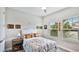 Sunlit bedroom boasts two windows, offering a serene view and creating a bright and airy atmosphere at 5927 Maidenstone Way, Palmetto, FL 34221