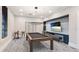 Stylish billiards room with a pool table, bar seating, and a TV, great for entertainment and relaxation at 5927 Maidenstone Way, Palmetto, FL 34221