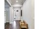 Inviting entryway with hardwood floors, elegant white trim, and an abundance of natural light at 5927 Maidenstone Way, Palmetto, FL 34221