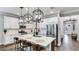 Beautiful kitchen with white cabinets, stainless steel appliances, and a spacious island with seating at 5927 Maidenstone Way, Palmetto, FL 34221