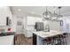 Bright kitchen featuring white cabinets, quartz countertops, stainless appliances and a large island at 5927 Maidenstone Way, Palmetto, FL 34221