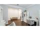 Well-lit room with a wooden bench, built-in shelving, and a neutral color palette at 5927 Maidenstone Way, Palmetto, FL 34221