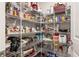 Walk-in pantry offering ample storage space with organized shelving for all your kitchen essentials at 5927 Maidenstone Way, Palmetto, FL 34221