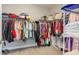Walk-in closet is well-organized with clothing racks, shelves, and plenty of storage space at 5927 Maidenstone Way, Palmetto, FL 34221