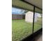 View from porch of the fenced backyard with a shed, perfect for outdoor activities at 6048 Merril St, North Port, FL 34287