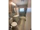 Cozy bathroom with a shower-tub combo, updated vanity, and mosaic tile flooring at 6048 Merril St, North Port, FL 34287