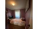 Cozy bedroom featuring a comfortable bed, soft lighting, and ample space at 6048 Merril St, North Port, FL 34287