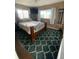 Comfortable bedroom with natural light, a decorative rug, and stylish furnishings at 6048 Merril St, North Port, FL 34287
