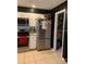 Well-equipped kitchen featuring stainless steel appliances and convenient pantry access at 6048 Merril St, North Port, FL 34287