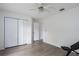 Bright bedroom featuring wood-look floors, a ceiling fan, and a closet at 6114 68Th E Dr, Palmetto, FL 34221