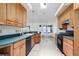 Bright kitchen offering wood cabinetry, appliances, and an adjacent dining area at 6114 68Th E Dr, Palmetto, FL 34221