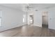 Spacious main bedroom offers a ceiling fan, large windows, and an ensuite bathroom at 6114 68Th E Dr, Palmetto, FL 34221