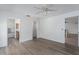 This Main bedroom has a ceiling fan, and doorways to the bathroom and hallway at 6114 68Th E Dr, Palmetto, FL 34221