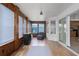 Inviting sunroom with wood paneling, lots of windows, and a sliding door at 6114 68Th E Dr, Palmetto, FL 34221