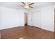 Bedroom featuring wood-look flooring, a ceiling fan, and a closet at 6341 Cocoa Ln, Apollo Beach, FL 33572
