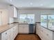 Kitchen with stainless steel appliances and granite countertops, showcasing water views at 6341 Cocoa Ln, Apollo Beach, FL 33572