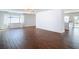 Spacious living room with wood-look floors and ample natural light at 6341 Cocoa Ln, Apollo Beach, FL 33572