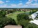 Aerial view of the golf course and surrounding homes, showcasing the community layout and green spaces at 6821 Fairview Ter # 6821, Bradenton, FL 34203