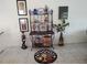 A cozy dining room space with a metal bakers rack, stylish decorations, and a unique rug at 6821 Fairview Ter # 6821, Bradenton, FL 34203