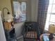 Comfortable chair with table, lamp and window in a cozy living area at 6821 Fairview Ter # 6821, Bradenton, FL 34203