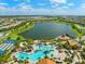 A panoramic aerial view of the community lake, clubhouse, and resort-style pool at 6854 Chester Trl, Lakewood Ranch, FL 34202