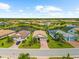 Stunning aerial view showcasing the property, lake, landscaping, and community at 6854 Chester Trl, Lakewood Ranch, FL 34202