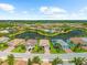 Gorgeous aerial view of a luxurious home community with beautiful landscaping and serene lakes at 6854 Chester Trl, Lakewood Ranch, FL 34202