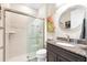 Modern bathroom featuring a glass-enclosed shower and granite countertop vanity at 6854 Chester Trl, Lakewood Ranch, FL 34202