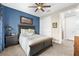 Comfortable bedroom featuring carpet, a ceiling fan, and ample closet space at 6854 Chester Trl, Lakewood Ranch, FL 34202