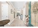 Bright foyer featuring wood-look tile flooring, an arched doorway, and decorative glass front door at 6854 Chester Trl, Lakewood Ranch, FL 34202