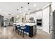 Stylish kitchen featuring pendant lighting, an island with seating, and modern appliances at 6854 Chester Trl, Lakewood Ranch, FL 34202