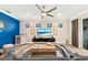 Bright living room showcases decor, a ceiling fan, and a modern entertainment center by the sliding door at 6854 Chester Trl, Lakewood Ranch, FL 34202