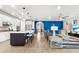 Open-concept living space showcasing the living room and kitchen, with sleek flooring and modern design at 6854 Chester Trl, Lakewood Ranch, FL 34202