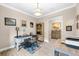 Inviting office featuring a decorative light fixture, tiled floors, and a view into an additional room at 6854 Chester Trl, Lakewood Ranch, FL 34202