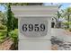 Close-up of the address marker, displaying the house number on a stone plaque at 6959 Westchester Cir, Bradenton, FL 34202