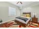 Cozy bedroom with a stylish area rug and a comfortable bed frame, creating a relaxing and inviting atmosphere at 6959 Westchester Cir, Bradenton, FL 34202