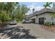 Driveway leading to a two-car garage, with vehicles parked in front of the home at 6959 Westchester Cir, Bradenton, FL 34202