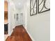 Hallway featuring stylish decor, with wood flooring that adds a sense of warmth and sophistication at 6959 Westchester Cir, Bradenton, FL 34202