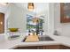 Bright kitchen with a stainless steel sink and faucet overlooking the screened-in pool and patio area at 6959 Westchester Cir, Bradenton, FL 34202